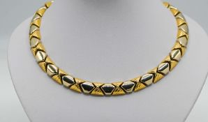 A fine18ct gold necklace and slave bangle to match (2), 111.70g.