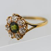 A fine Victorian green sapphire and diamond ring, with a cluster of seven old cut diamonds, set in