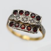 An 18ct and platinum diamond and garnet plaque ring, set with an arrangement of 10 garnets and 5