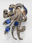 A diamond and sapphire spray design brooch, approx 16.1g, 5cm long (not hallmarked).
