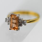 An imperial topaz ring, set with six round cut diamonds, in 18ct yellow gold, approx 3.9g, size N.