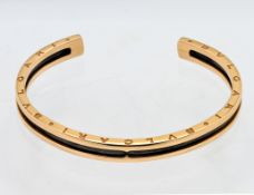 Bvlgari, a 18ct gold and steel bangle, size small, marked 2337AL, A8W49A. With copy of sales invoice