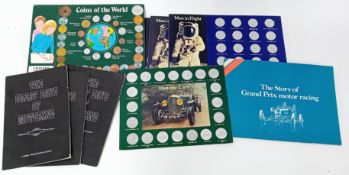 A collection of historic car memorabilia, together with three 'Man in Flight' commemorative