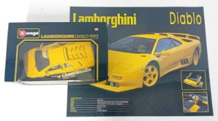 Burago, Lamborghini Diablo (1990), boxed, together with a laminated poster. (2)