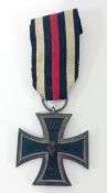A WWI Second Class Iron Cross on striped ribbon.