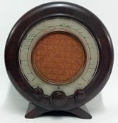 A vintage circa 1940 brown Bakelite Ekco type A22 valve radio, height 36cm.