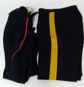 A Second World War WWII cream blouse and trousers with bag, together with a two pairs of black