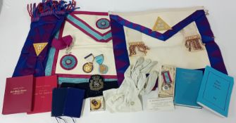 A collection of masonic aprons, medals, and books, together with various documents, photographs,