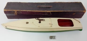 A Kellner clockwork model boat, circa 1902 made in Germany, green base with red painted interior,