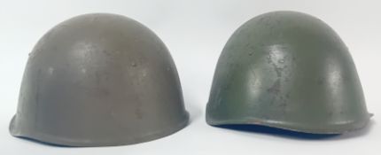Two Eastern Block Russian Style Helmets.