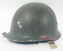 A Gulf War Iraqi Kevlar Helmet.