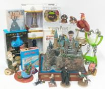 A large collection of Harry Potter collectables, to include books, DVDs, figures, games, puzzles,