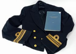 A 1950s Lieutenant Commanders Mess Dress Jacket, together with a Naval Ratings Handbook.