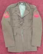 A US Marine Corps green jacket, with Marine Corps badges to arms.