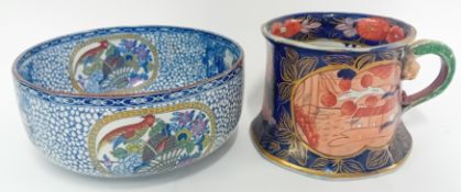 A decorative blue and white ceramic bowl, decorated with cockerels, together with a large cider mug,