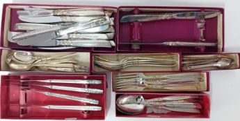 A collection of stainless steel cutlery and flatware, to include dessert forks, dessert spoons,