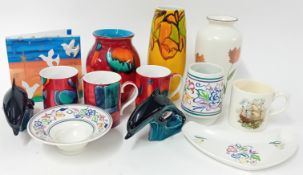 A collection of Poole pottery, to include art pottery vases and mugs, together with dolphin