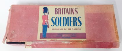 A collection of early 20th century 'Britain's Soldiers', painted tin-plate toy soldiers, some with