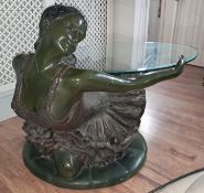 A modern patinated bronze ballerina coffee table, after Auguste Moreau, with an oval glass top,