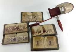 An Edwardian handheld Stereoscopic viewer, foliate decoration by U&U, with approx 20 stereo