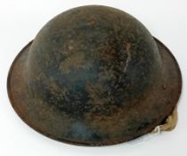 A WWII Brodie Helmet MkII non-combat issue, with chin strap and lining. No marking, possibly a