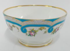 A decorative Victorian ceramic bowl by Minton's, blue decoration with floral and gilt details.