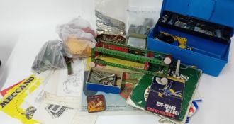 A large collection of Meccano, to include plates, nuts, bolts, vehicle parts, etc, together with