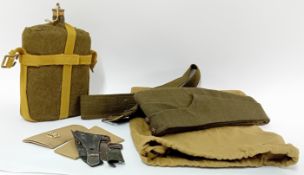 A collection of Second World War WWII personal clothing and items, to include caps, a water canteen,