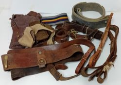A collection of Second World War WWII leather belts and webbing.
