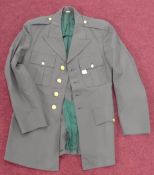A US Army Uniform jacket, of green wool and polyester, eagle detail to gilt buttons.