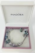 A Pandora bracelet with approx 13 charms.