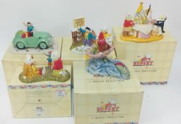 Five Royal Doulton Rupert Bear porcelain figurines, to include 'Rupert with the King', 'Tempted to