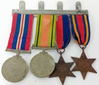 A set of WWII medals, to include 1939-1945 medal, Defence Medal, and two WWII Stars.