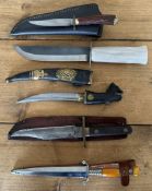 Five assorted knives, one with a white handle and 18cm blade, the stiletto with a 15cm blade, one