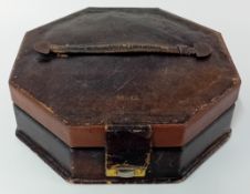 A 20th century military sewing kit, the octagonal box of brown leather and marked 'M.G', to