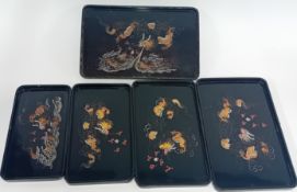 A set of five lacquered Japanese trays, in increasing size with dragon motif, stackable. (5)