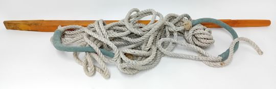 A long wooden ship's tiller, length 152cm, together with a pair of custom-made mooring ties of suede