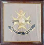 A large embroidered study of the Sherwood Foresters cap badge, completed by Pte. Arthur Elkington