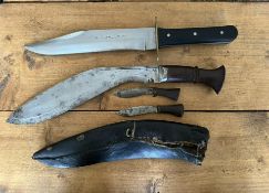 A full tang Bowie clip point, blade length 23.5cm, together with a Kukri, blade length 28cm (small