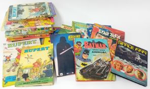 A collection of Rupert Annuals, together with a Batman, Star Wars, and Star Treck annual, etc.