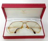 A red leather cased pair of vintage Must de Cartier bicolour gilt 140 aviator sunglasses,