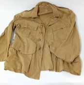 A World War One WWI Royal Marine cotton blouse with crown and metal pips to shoulder tabs. Captain