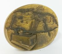 A D-Day commemorative brass paperweight, with relief depiction of the coast and inscription to