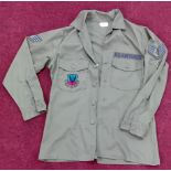 A US Air Force green shirt, with Tactical Air Command embroidered badge to breast pocket, and US Air