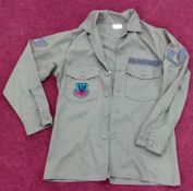 A US Air Force green shirt, with Tactical Air Command embroidered badge to breast pocket, and US Air
