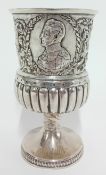 A George III silver goblet, embossed floral decoration and Victorian Officer's profile, inscribed