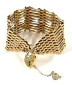 A 9ct gold wide gate bracelet, approx 21.6g.