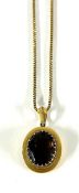 A gold smokey quartz pendant on a gold chain (not hallmarked), approx 16.5g.