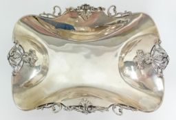 A continental silver decorated rim dish on feet, stamped 900, overall total weight approx 11.26oz.