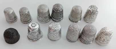 A collection of silver thimbles, to include nine hallmarked pieces, together with three others,